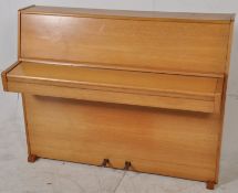 A 20th cenuty Lindner of Shannon, Ireland  ( Irish ) overstrung upright piano set within a light oak