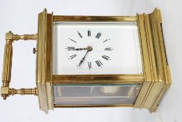 A large 19th century French brass cased repeater carriage clock having platform escapement atop. The
