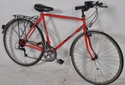 A retro 1980's Coventry Eagle mens touring bicycle in red having 26" wheels