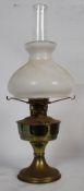 A Victorian Aladdin 23 brass oil lamp. The circular terraced base of stepped form having a bulbous