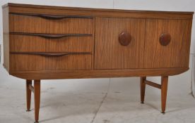 A retro 1970's formica faux teak wood low sideboard. Raised on tapered legs with a series of