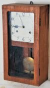 A 20th century metal faced station clock / clocking in style.  The square face set within a ply