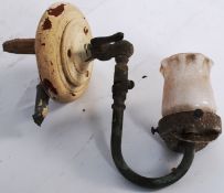 A late Victorian electric wall sconce fitting complete with shade habing wooden wall bracket and