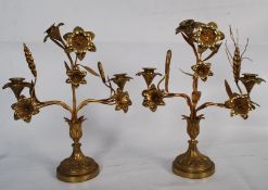 A pair of 20th century brass candelabras