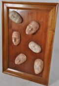 A large abstract wall hanging of plaster moulds by Giff. Dated 2000 and entitled