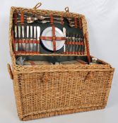 An early 20th century pre war whicker & canvas motoring hamper, possibly Bentley / Rolls Royce