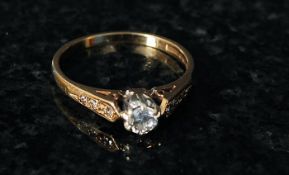 A 9ct gold ladies suspension set diamond ring mounted to a plain hoop