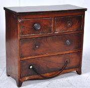 A Georgian mahogany apprectice piece chest of drawers two over two drawers on bracket feet. H35cm x