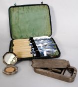A cased set of fish knives and forks, a small silver plate compact and a cased Art Deco style Rolls