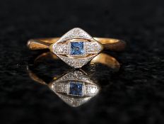 A 1920`s 18ct gold ladies sapphire and diamond ring. The central set sapphire with diamond surround