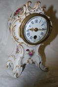 A Dresden rococo style porcelain drumhead clock