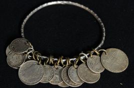 A silver ladies bracelet having continental coins