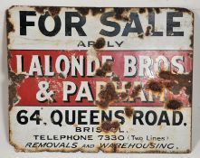 An advertising enamel sign for Queens Road, Bristol. Notation for a building for sale.
