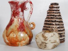 Two studio pots 1952/1969 along with a stone candle holder.