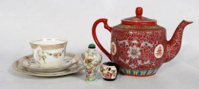 A Chinese red painted teapot along with 2 hand painted snuff bottles and a trio of Balmoral china