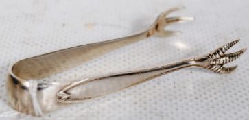 a silver hallmarked pair of sugar tongs in crow feet form marked for cooper brothers and sons