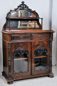 A Regency 19th century rosewood chiffonier sideboard. The squat bun feet supporting a well