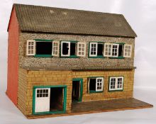 A 20th century childs two-tier dolls house.