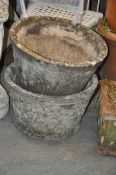 A pair of 20th century stone planters. Of circular form, waisted to the base having lattice style