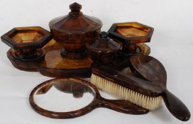 A large 1930`s Art Deco decorative smoked amber glass dressing table set having tray, candlesticks,