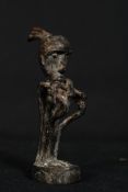 A 19th century African decorative 20th century bronze tribal art figure of a seated man with