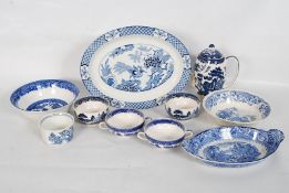 A collection of assorted blue and white willow pattern china to include tea pot, bowls, soup,