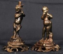 A pair of 18th century bronze statues of cherubs, roccoco style being signed to bottom CTT.