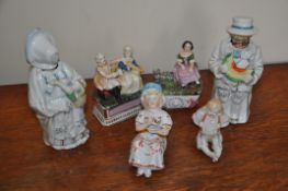 A collection of 19th century continental figurines to include lidded small pots, seated figures and