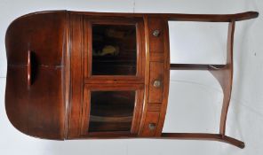 A Georgian ebony strung mahogany inlaid corner cabinet. The splayed legs supporting a central