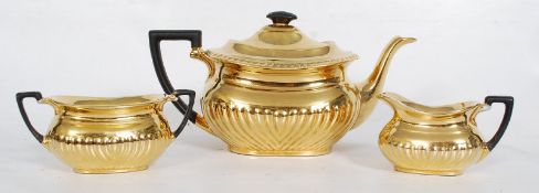 A part Crown Devon gold lustre tea set, with teapot