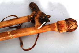 Two vintage walking canes with zoomorphic Horse and St Bernard dog heads.
