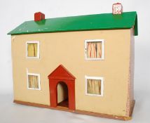 A large childrens dolls house having sliding panel back with colourful roof and lined interior