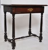 An 18th century oak lowboy table. The inverse tapered reeded legs united by stretchers with pad