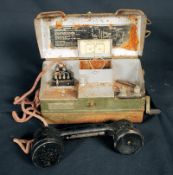 A 20th century military army field telephone, in original box with wiring and assembley