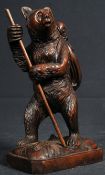 A 20th century Black Forest carved wooden bear