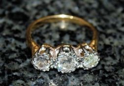 A 3 stone diamond ring 18k approx 1 carat. Size Q.