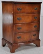A Georgian style mahogany dwarf bow front chest of drawers. Bracket legs with a bank of drawers