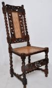 A 19th century carved oak Carolean revival barley twist bergere hall chair. The Barley twist legs