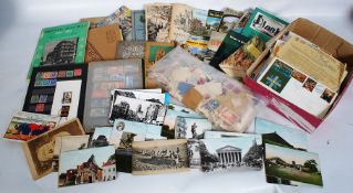 A quantity of mixed ephemera to include stamps, first day covers, postcards and a Reece Winston
