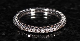 An 18ct white gold diamond full eternity ring. 1.8g