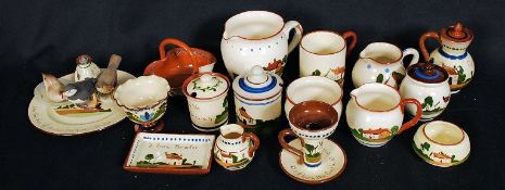 A good collection of Torquay Mottoware to include conserves, candlestick, plates etc.