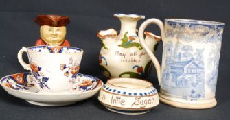 A mixed lot of china  to include a Victorian blue and white cider jug in the willow pattern along