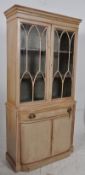 A 20th century American style painted shabby chic library bookcase cabinet. The plinth base