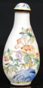 A 20th century ceramic chinese perfume bottle having foliate decoration.
