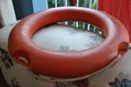 A retro Italian made decorative life preserver buoy in orange. 57cm diameter.