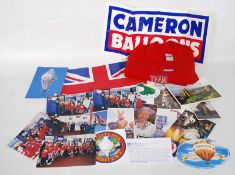 A collection of items ephemera relating to Cameron Balloons` trip around the world. Including an