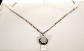 An Italian silver necklace stamped 925 with a cabochone opal pendent with ribbed border. 12g.