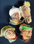 3 plaster Bossons figure heads. One being Robin Hood, a pirate and an Arabic gentleman with horses
