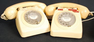 Two 1970`s retro cream telephones.