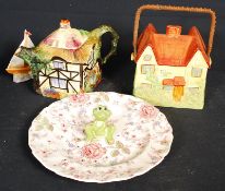 A Crown Devon cottage biscuit barrel, a Rubian art cottage teapot and others.